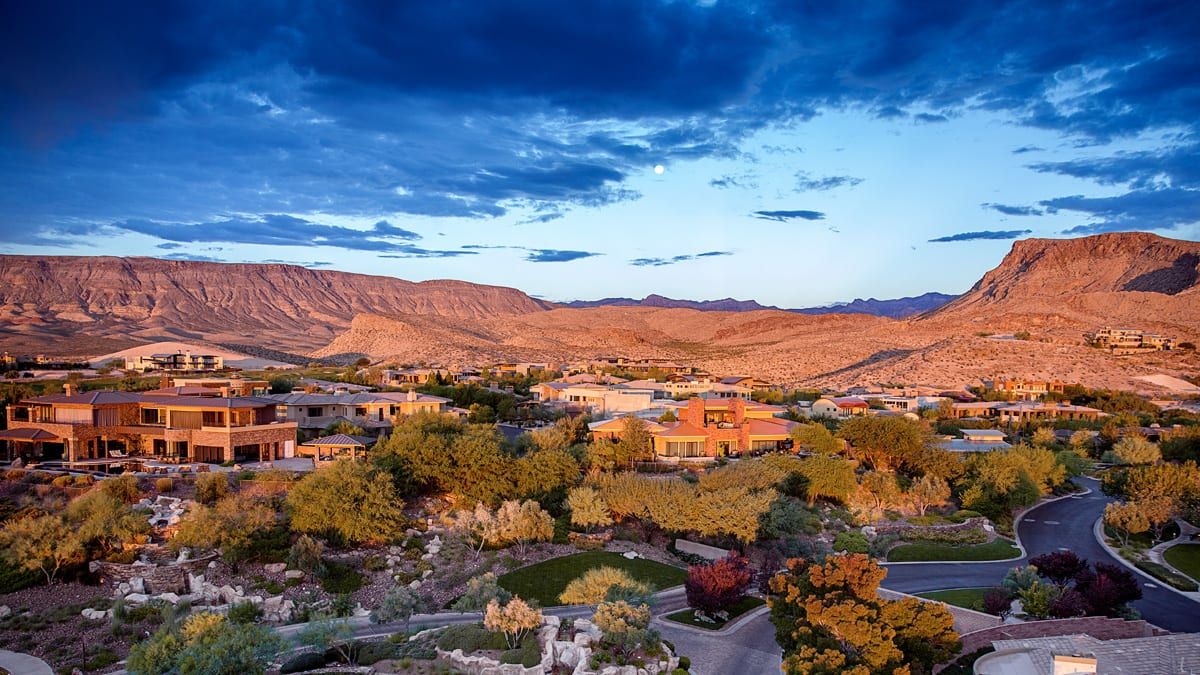 Summerlin, Las Vegas NV homes at golden hour with Red Rock mountains beyond