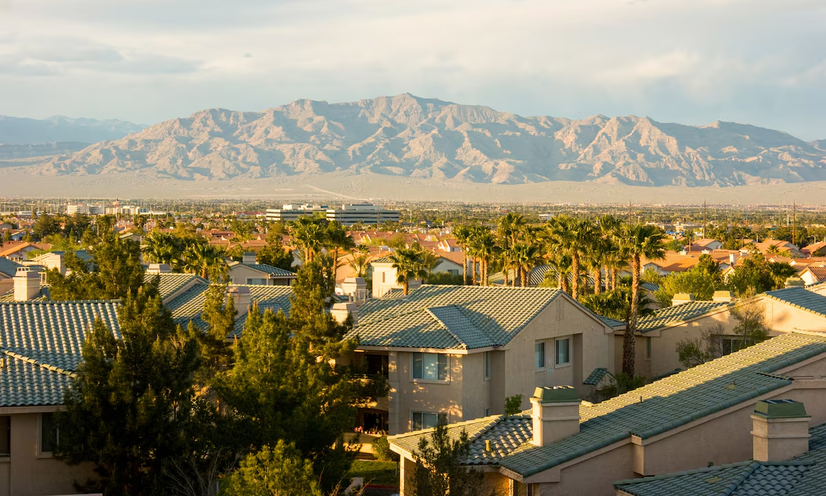 North Las Vegas residential neighborhood with tile-roof homes and mountain views at golden hour